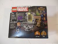 Box front showing LEGO Marvel set 76253 Guardians of the Galaxy Headquarters, 67 pieces, ages 7+, with Star-Lord and Groot mini-figures