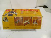 Original yellow box for Zyliss Profi-King table top clamp and vise with product images and instructions in German.