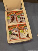 Opened box showing the 36 sealed packs of 1991 Score NHL Hockey Cards Series 1, each pack with player images on the packaging.
