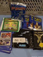 Overview of multiple sealed trading card packs including Transformers, Power Rangers, Maverick, Tek World, and Joe Jusko.