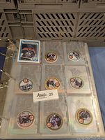 First binder page: one standard Gretzky Oilers card at top left and eight circular coin-style insert cards, each featuring Wayne Gretzky in Oilers uniform