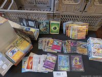 Overview of all cards, stacks and sealed booster pack on table