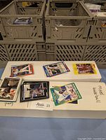 Photo showing loose baseball cards laid out on a box labeled 'mixed baseball' with various players appearing on the cards from different brands.