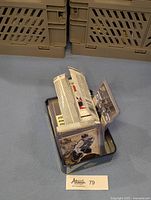 Tin box containing more than 60 hockey cards and unopened packs.