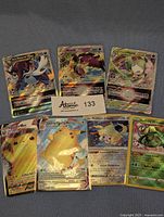 All seven cards arranged on cloth