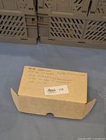 Photo of the closed box with handwritten note describing the contents as hundreds of vintage 1985 Upper Deck NHL cards, including rookies and stars like Kelly Hrudey and Mark Messier.