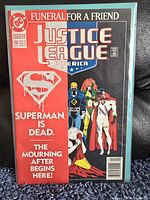 Front cover of Justice League America #70 comic book featuring the title 'Superman is Dead' and several Justice League characters.