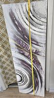 Full view of vertical rectangular abstract painting with purple, white, black, and gray swirls and patterns. Measuring tape shows approximately 41 inches tall.