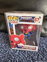 Front view of the Mantenna Funko Pop figure inside its original window display box showing character and branding details.