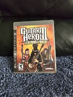 Front cover of the PlayStation 3 game Guitar Hero III Legends of Rock showing cover art and branding.