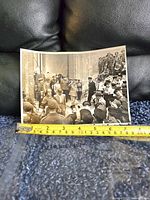 Photo showing the original black and white photograph with tape measure indicating approx 9 inches width.