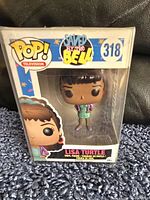 Photo of new Lisa Turtle Funko Pop vinyl figure in original box with Saved by The Bell branding and number 318 on box.