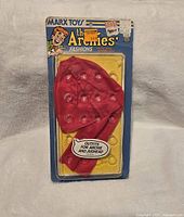 Photo of sealed vintage Archie doll clothes outfit in original packaging showing red jacket and hat.