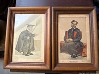 Two Vanity Fair clerical character prints in wooden frames, showing detailed period attire and caricature style.