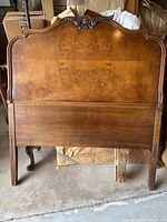 Front view of walnut burl headboard showing overall design