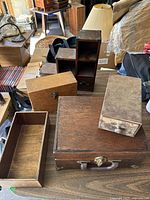 Overview of all wooden boxes on table showing different types and sizes