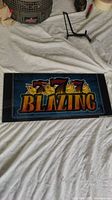 Full view of the Blazing 7s slot machine glass panel laid flat, showing entire graphic design and size context.