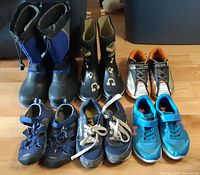 All six pairs size 2 footwear displayed