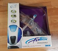 Front of boxed WowWee FlyTech Dragonfly showing product graphics and 27 MHz label