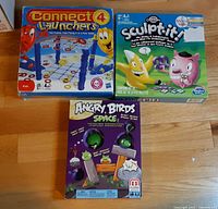 Three boxed games: Connect 4 Launchers, Cranium Sculpt-It, Angry Birds Space