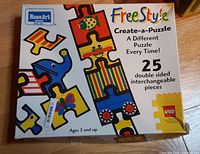 Front of box showing product name, branding, age recommendation, 25 double-sided pieces note