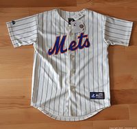 Front view showing Mets script, button front, tag, brand patch