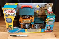 Front of sealed box showing playset image and contents