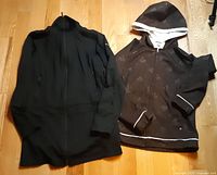 Black and brown Columbia jackets side by side to show both items