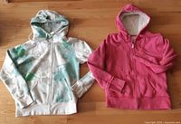 Both hoodies side by side front view