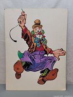 Full view of the clown illustration showing the entire figure holding a whip.