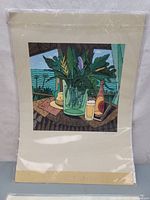 Full view of Fernando Bellver Pacifico contemporary still life art print showing foliage, bottle, glass and tropical background, sealed in protective plastic.