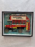 Framed 3D artwork of the omnibus bus showing full piece with signage and bus details