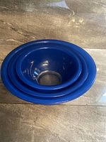 Top view showing all three blue nesting mixing bowls stacked inside each other.