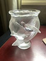 Angled front view showing both raised doves and swirling body pattern