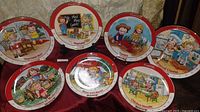 All seven Campbell's Kids collector plates displayed