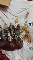 Group view of nativity figures, ornaments, bells