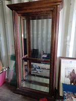 Full view of wood and glass display cabinet