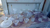 Entire assortment of glass and crystal pieces displayed on table