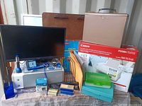 Group shot showing monitor, printers, lockbox, clipboard, whiteboard, file rack, storage boxes