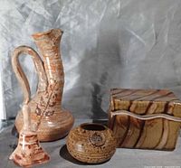 All four pottery items grouped: pitcher, bell, bowl, trinket box