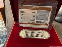 Abacus in box with certificate behind