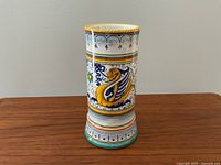 Front view of the Grazia Deruta Italian vase displaying the dragon and floral ceramic painting.