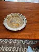 Glass insert fitted into the silver tray, showing the full butter dish assembled on wooden table.