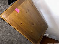 Top view of the wood frame coffee table surface showing wood grain and rectangular shape.