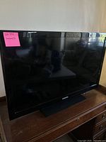 Front view of Samsung flat screen TV showing the 35 inch screen and black bezel.