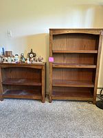 Photo of two wood bookshelves side by side showing overall construction and condition.