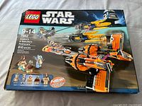 Front of the LEGO Star Wars 7962 set box showing podracers and minifigures, with brand, product line, item number, and piece count visible.