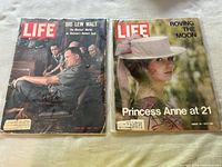 Photo showing two Life magazine issues from 1967 and August 20, 1971, covers featuring Big Lew Walt and Princess Anne