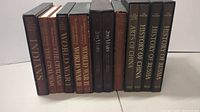 Photo showing spines of 11 American Heritage history books on various subjects like Indians, World War II, Civil War, China, Russia