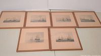 Six framed naval battle prints arranged in two rows, showing all artworks and frames.